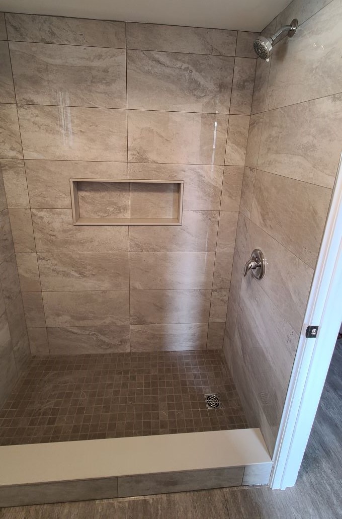 Renovated shower with a recessed tile shelf for Dan Fauteux